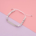 Adjustable marble bead bracelet with a polished stainless steel curved bar and white cord - Marble White (White Turquoise)