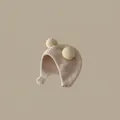 Detail showing beige fleece kids thermal hat with cute yellow pompom ears and earflaps - Beige Pom-pom Hat (for 2 Months To 2 Years Old)
