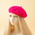 Classic fuchsia cashmere-like wool beret hat shown on a display model for women - One Size / Rose Red