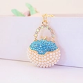 Portachiavi a borsa creativo con strass blu e perle bianche su metallo dorato - Blu