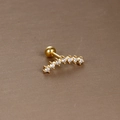 Golden stainless steel cartilage stud featuring a curved row of seven zircon stones - Gold White Zirconia (Arc Seven Stone)