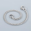Detail of silver stainless steel cuban link pants chain with dragon head clasp - 16" / Bat Clasp
