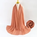 Solid orange pearl chiffon scarf for women draped elegantly on a mannequin - Beige