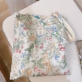 Flat lay of a large floral cotton tote bag with berry patterns and woven label detail - Yellow Berry Print