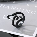 Macro shot of black octopus tentacle ring with detailed suction cups and matte finish - Adjustable Open / Squid Tentacles