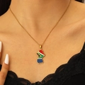 Detail of South Africa map pendant necklace with flag colors worn by a model - 18K Gold South Africa Style