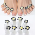 Detail shot of daisy-shaped silicone toe separators with sparkling rhinestone accents - Black Gray Yellow Flower Style (08)