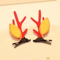 Pair of red reindeer antler hair clips with yellow leaves on a white ceramic plate - Hair Clip 15# (Pair)