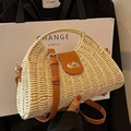 Beige straw woven crossbody bag with brown leather accents and gold twist lock - Beige