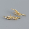 Exquisite gold sunburst earrings with micro-pave cubic zirconia on gray background - 925 Silver / Gold