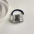 Silver metallic hair tie with irregular textured surface and black elastic band - Water Wave Rectangle Silver