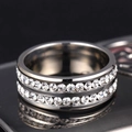Macro view of double-row pavé set cubic zirconia on a polished silver stainless steel ring - US 6 / Silver