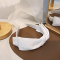 Elegant white fabric headband with a double bow knot design on a premium leather base - White
