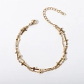 Detailed view of a gold double-layer chain bracelet with cross charms and beads on white - 17+5cm / Cross Bead Chain + Cross Pendant Bracelet / Gold