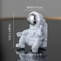 White astronaut night light ornament with silver visor, measuring 4.5 x 5.2 x 4.1 cm - Silver Astronaut Ornament