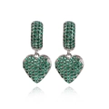 Close-up of silver heart earrings featuring vibrant green pavé-set gemstones and sleek metal - Green Zircon White Gold