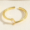 Detailed close-up of a golden open ring featuring a clear rectangular cubic zirconia stone - Adjustable Open / Single Zirconia Style (JZ0333)