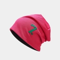 Detailed knit texture of deep pink slouchy beanie with green 7th logo embroidery - One Size / Rose Red