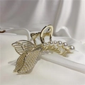 Close-up of golden mermaid tail hair claw with inlaid pearls on white silk - Single Fishtail Pearl Claw Clip