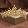 Macro view of golden Baroque bridal crown with amber rhinestones on a jewelry box - Champagne Gold