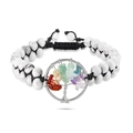 Detailed view of woven tree of life charm and colorful natural stone beads on bracelet - Howlite