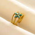 Macro detail of triple-layered gold stainless steel ring with turquoise flower gemstone - Adjustable Open / Gold-Light Blue