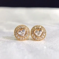 Close-up of heart-shaped halo stud earrings with gold plating and sparkling zircon stones - Heart / Gold