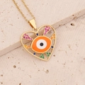 Close-up of golden heart pendant with evil eye and colorful zircon stones - Orange (8#)