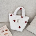 White plush mini tote bag featuring red heart patterns and a woven brand label - White Heart Jacquard
