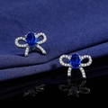Silver bow stud earrings with oval blue stone and micro-paved white zircons - Blue Diamond Bow Earrings Led-137