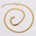 Detail of a golden snake chain necklace with lobster clasp and adjustable extension chain - Gold Color Cross Pattern