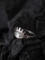 Macro shot of silver glowing eye ring with white stone on black background - Eye Style (NR302)