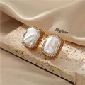 Vintage Baroque pearl earrings with champagne crystal halo, measuring 23.2mm by 20mm - K-0625 Pearl Rectangular Stud Earrings