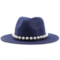Dark blue straw sun hat featuring a wide flat brim and decorative white pearl chain - Navy Blue