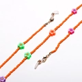Detail of orange beaded eyewear chain featuring colorful clay flowers and lobster clasps - Orange