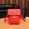 Red quilted crossbody phone bag with gold cat ear hardware and pearl tassel detail - Red