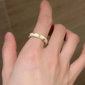Elegant gold plated enamel butterfly ring with white finish and sparkling crystals - Cream Pattern