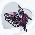 Detail of gradient butterfly hair claw clip with central crystal on a heart mirror - Black Purple Rhinestone Butterfly
