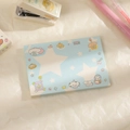 Flat lay of light blue star-patterned notepad with stationery accessories on textured paper - Blue Star Style