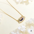 Macro shot of evil eye pendant with blue zircon center and gold box chain detail - Deep Blue Pupil Eye Style (NE2255-F)