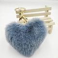 Blue plush heart keychain with gold ring and lobster clasp on mini wooden chair - Gray