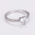 Macro shot of a heart-shaped zircon ring in stainless steel with side accent stones - Silver [White Zirconia]