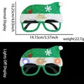 Grüne LED-Weihnachtsbrille mit Pailletten, Merry Christmas-Text und Leuchteffekt - Integrierte LED-Blinkbrille / Grüner Glitzer Weihnachtsmann-Hut-Stil