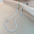 Elegant silver flat herringbone chain necklace in polished stainless steel on silk - 4mm Herringbone Chain Steel Color