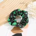 Detail of black satin scrunchie with green Halloween witch hat and cat silhouette patterns - Halloween #1 (Black Witch Cat)