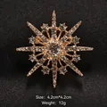 Elegant gold snowflake brooch with central zircon and sparkling stones, 4.2cm size - Snowflake Starburst Rhinestone Style (XD7996-2)
