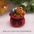 Miniature figurine d'ours de Noël en sac cadeau rouge pour décoration de paysage festif - Sac de Cadeaux Ornement