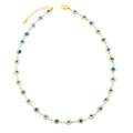 Fashionable golden Evil Eye necklace with blue and white resin eye charms on white background - White