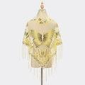 Detail of yellow lace shawl featuring intricate butterfly embroidery and long hanging tassels - Yellow