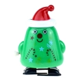 Close-up of a green Christmas clockwork toy with a red hat and candy cane patterns - Wind-up Walking Christmas Tree